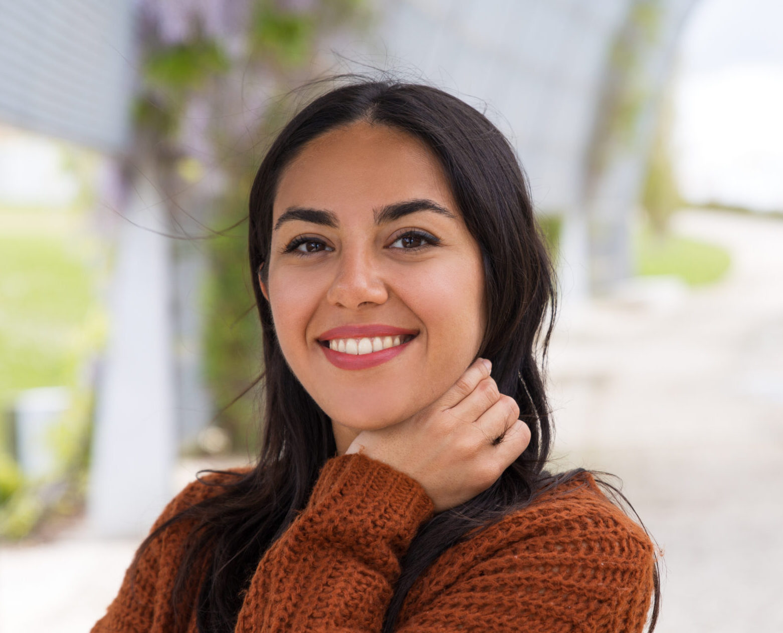portrait of happy excited asian girl adjusting hair